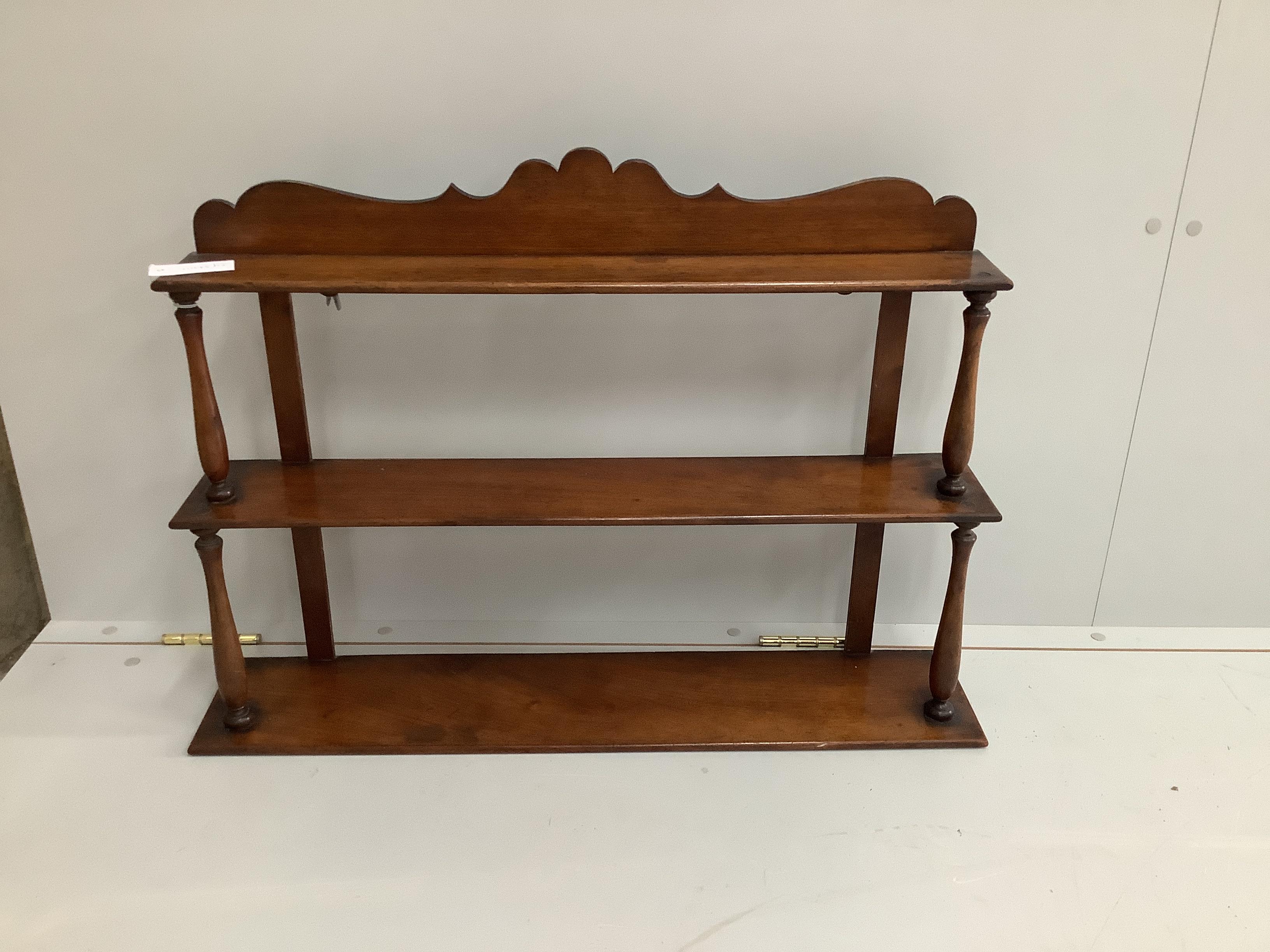 A Victorian mahogany three tier wall bracket, width 79cm, depth 16cm, height 56cm